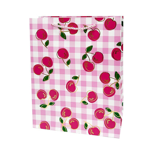 Gift bag with cherry pattern on a pink checkered background