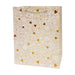 Beige gift bag with floral and heart pattern on a white background
