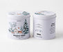 Two white cylindrical metal tea tins with winter-themed illustrations, showing the front and back labels of BISOU Winter Mint herbal tea.