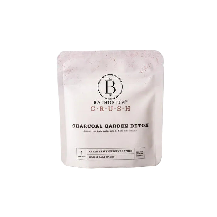 Bathorium Crush charcoal garden detox package on a tiled surface with a light gray background