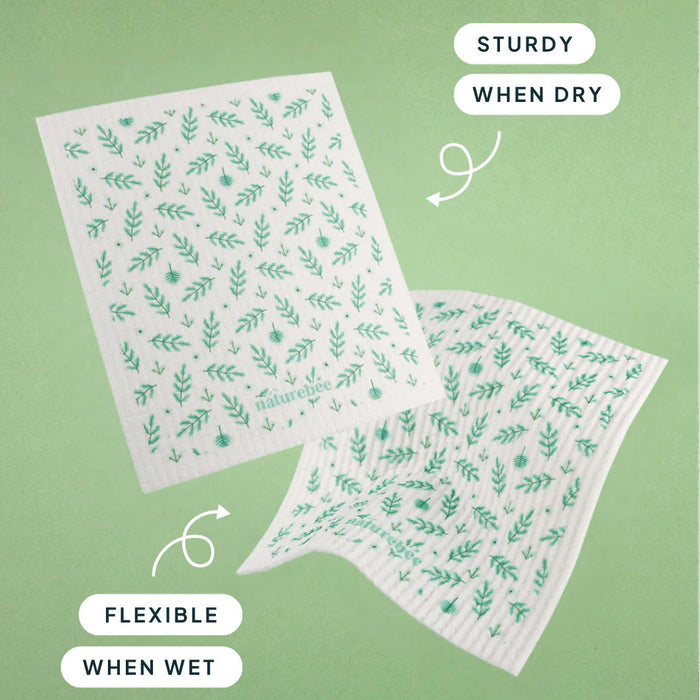 Two reusable wipes with leaf pattern on a green background, showing text about their properties.