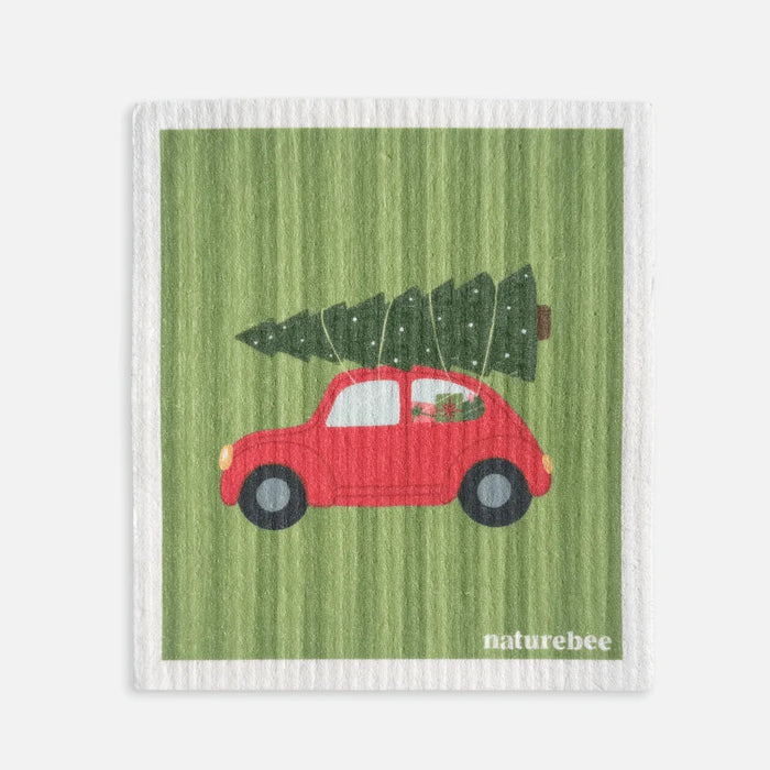 Green dishcloth with a red car and Christmas tree design, branded 'naturebee'.