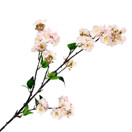 Artificial cherry blossom branch with pink flowers on a white background