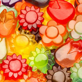Colorful assortment of flower-shaped gummy candies.