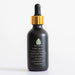 A black bottle with a gold dropper cap, labeled PROTECT Plant Vitamins with a green geometric design.