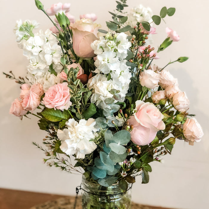 Soft and sweet floral bouquet in a hobnail vase 